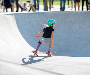 A young girl skateboarding
